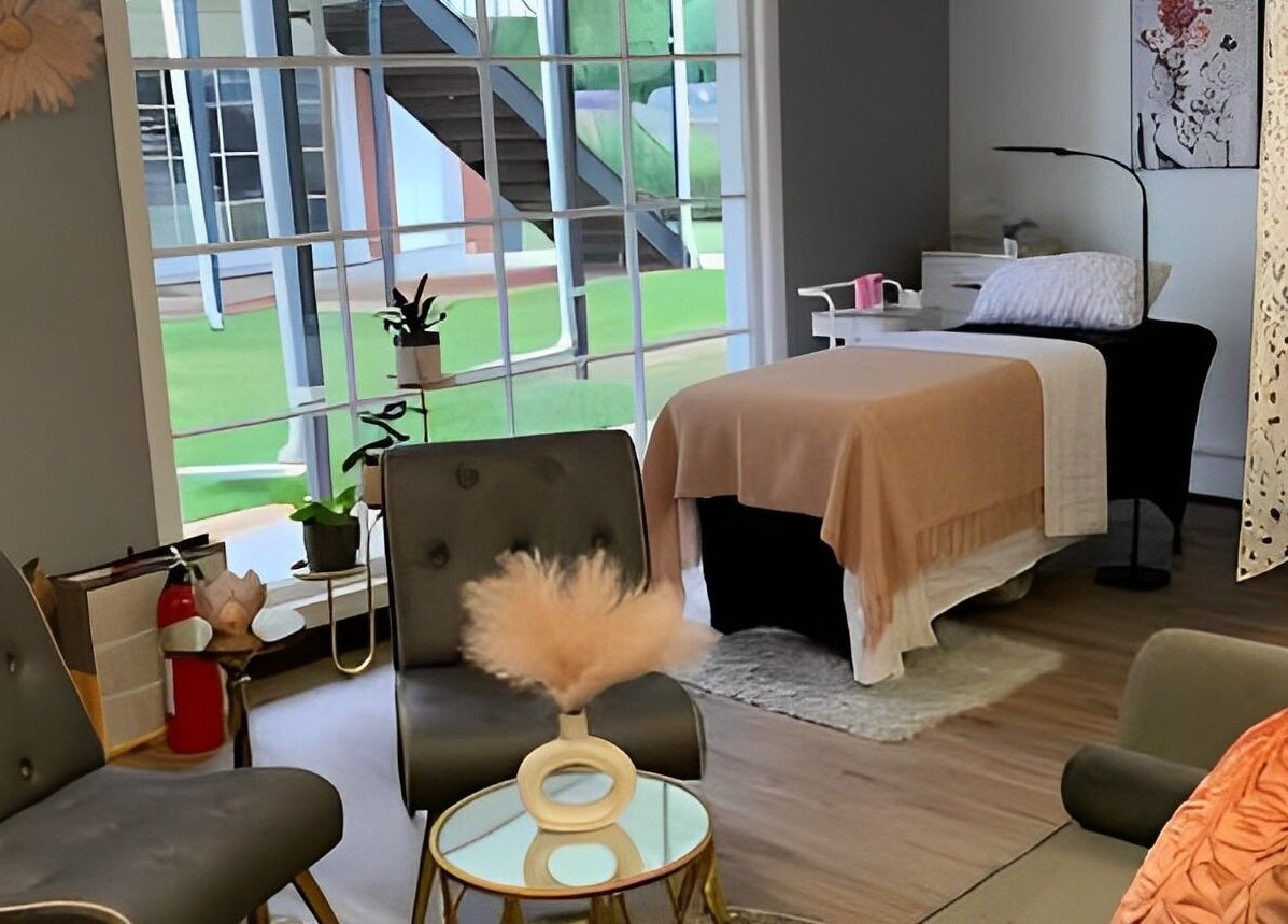 Cozy wellness room at The Skin and Brow Spot in Countryside, Illinois, US with elegant decor and treatment bed.