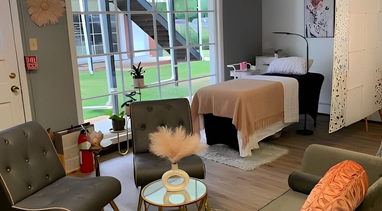 Cozy wellness room at The Skin and Brow Spot in Countryside, Illinois, US with elegant decor and treatment bed.