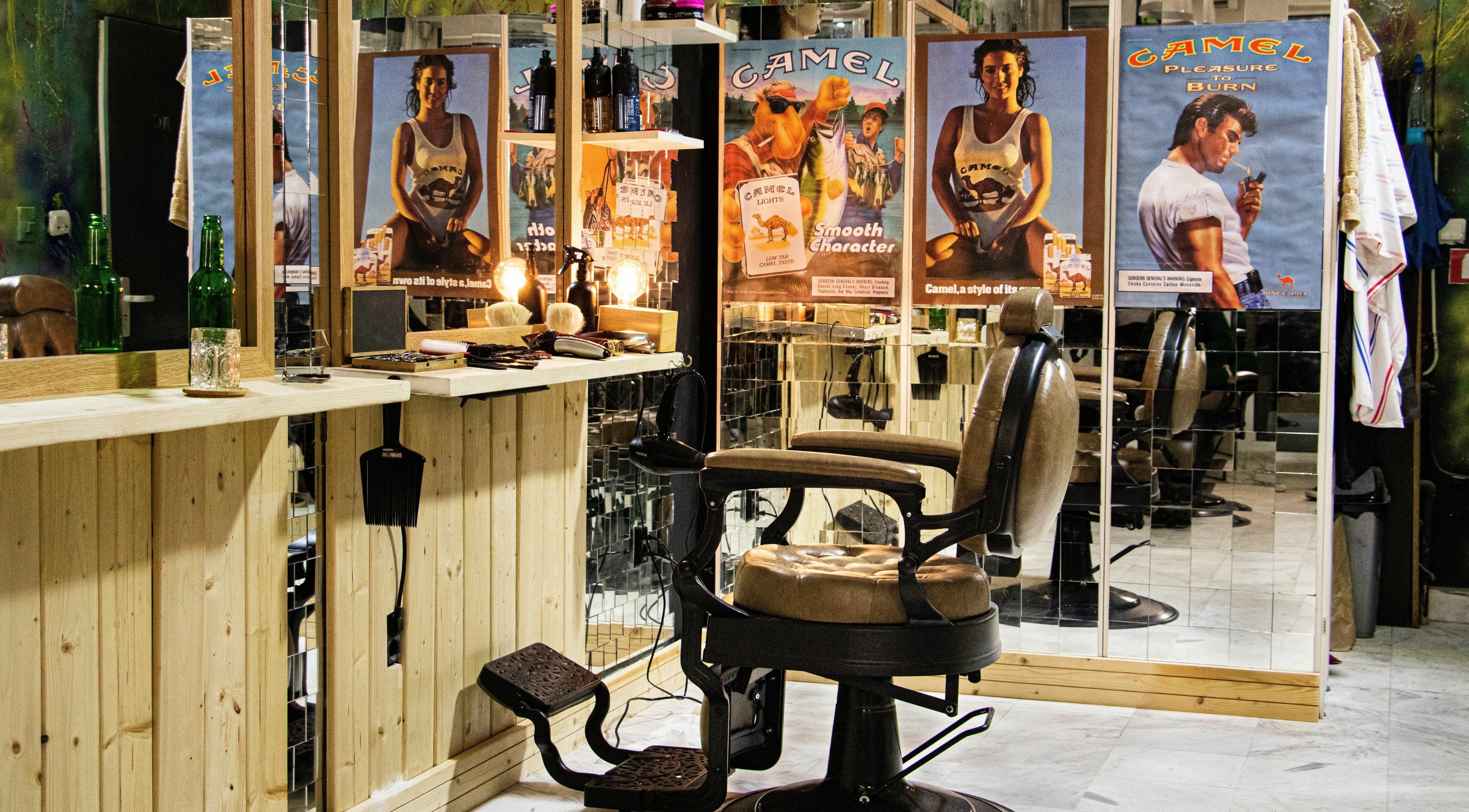 Vintage barber chair at Yo Hood Barbershop, Sofia, Sofia City Province, BG with classic decor and mirrors.