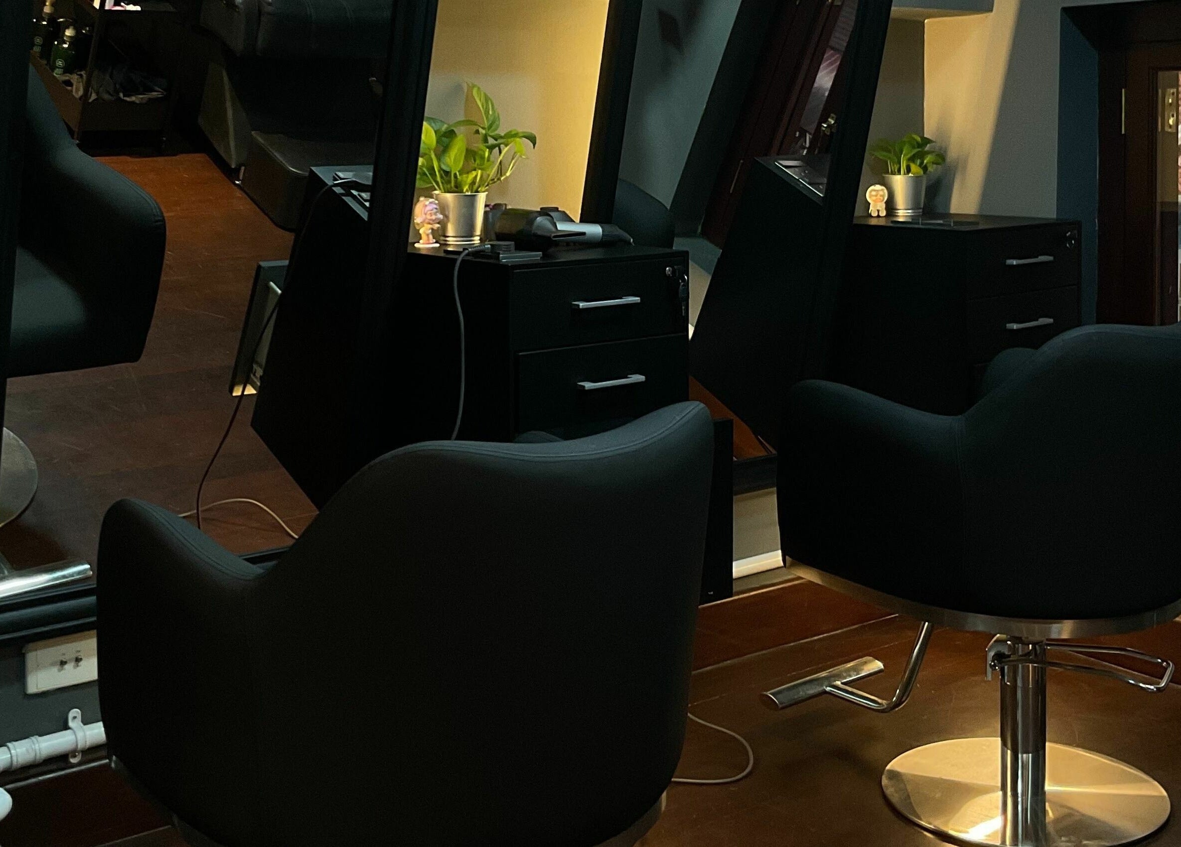 Elegant chairs at The Podium Salon & Barber .Co -Haji Lane-, Singapore, SG, offering a serene grooming experience.