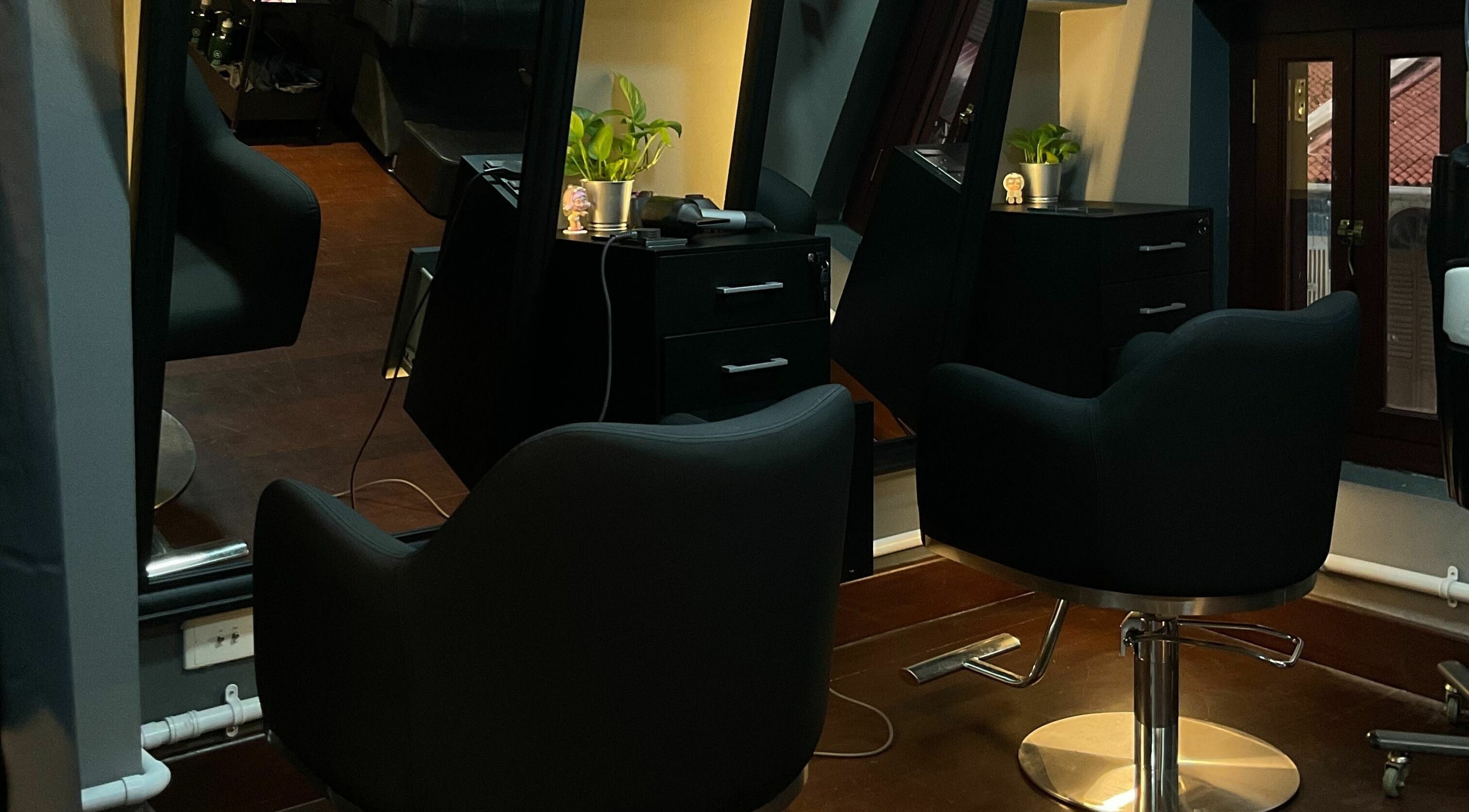 Elegant chairs at The Podium Salon & Barber .Co -Haji Lane-, Singapore, SG, offering a serene grooming experience.