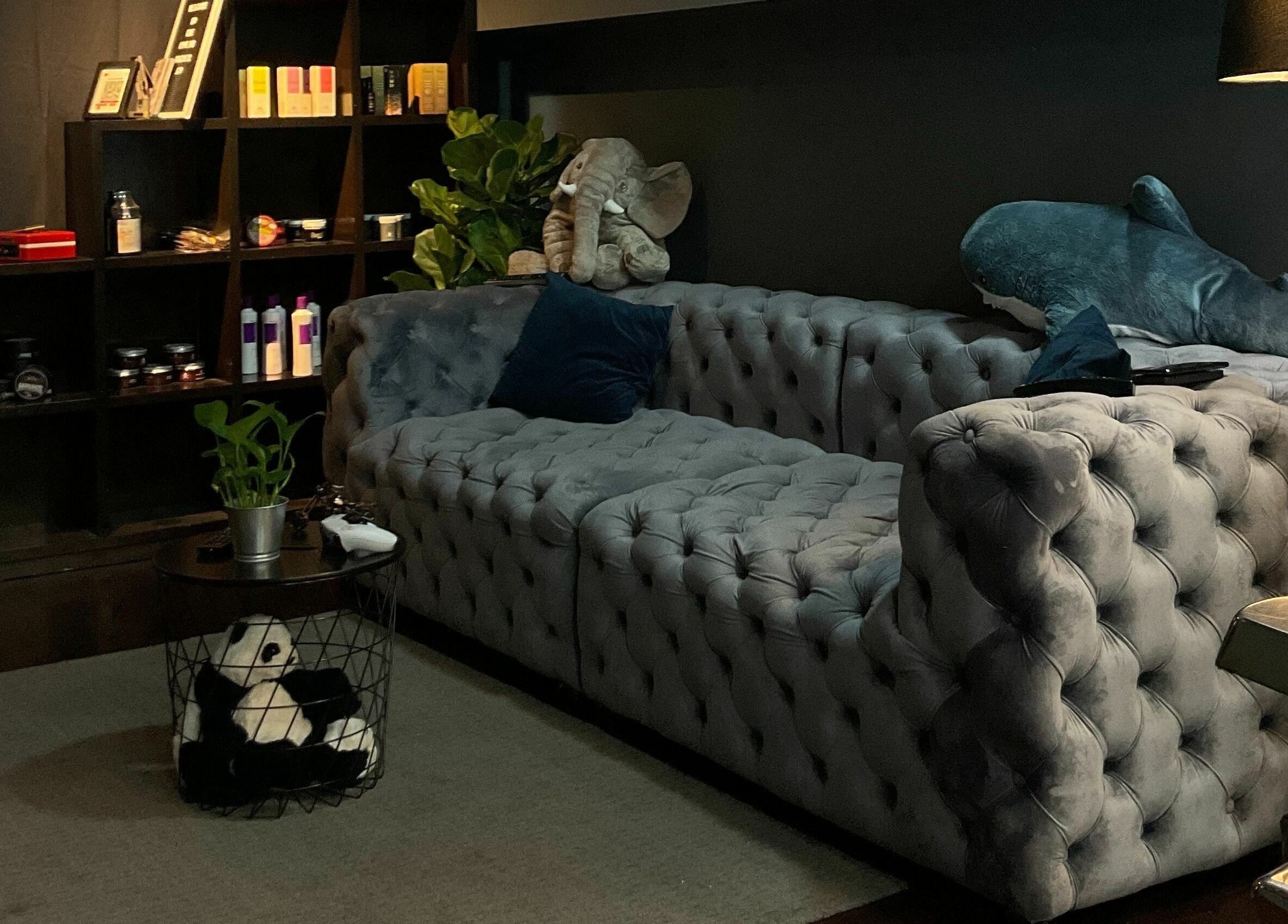 Cozy seating area at The Podium Salon & Barber .Co -Haji Lane- in Singapore, Singapore, SG with plush decor.