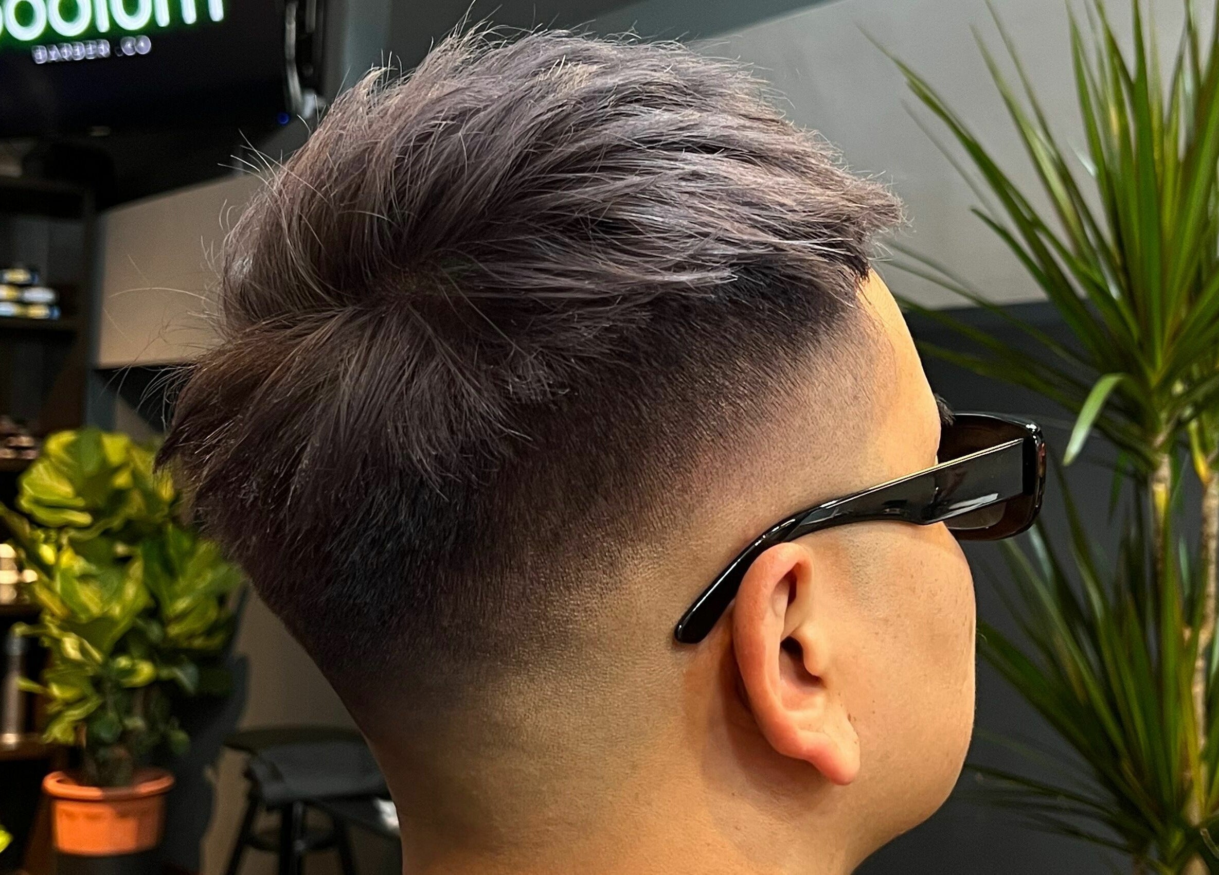 Modern haircut with a fade at The Podium Salon & Barber .Co -Haji Lane- in Singapore, Singapore, SG.
