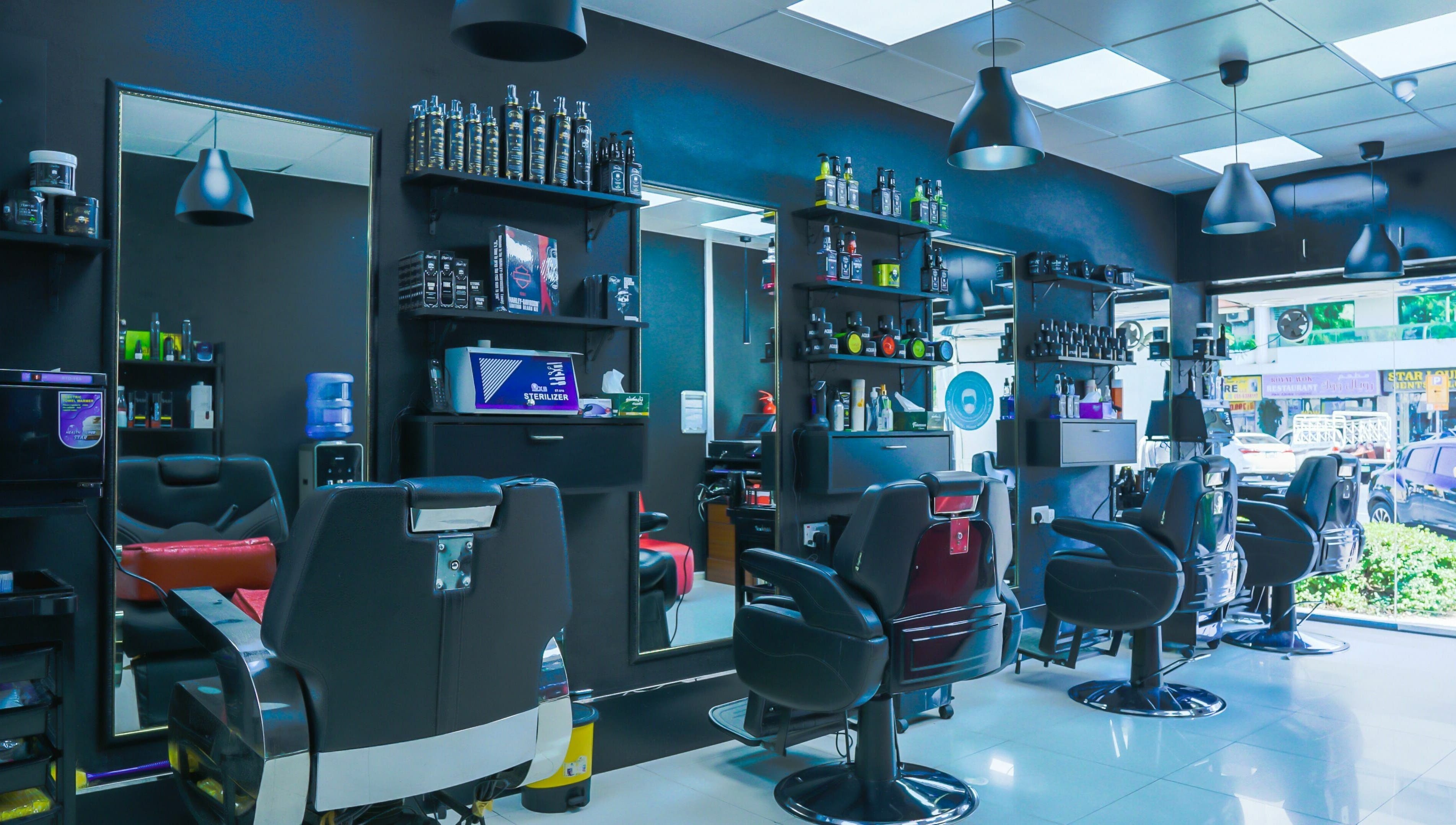 Chic interior of Fadez Gents Salon in Dubai, AE, featuring modern chairs and product displays.