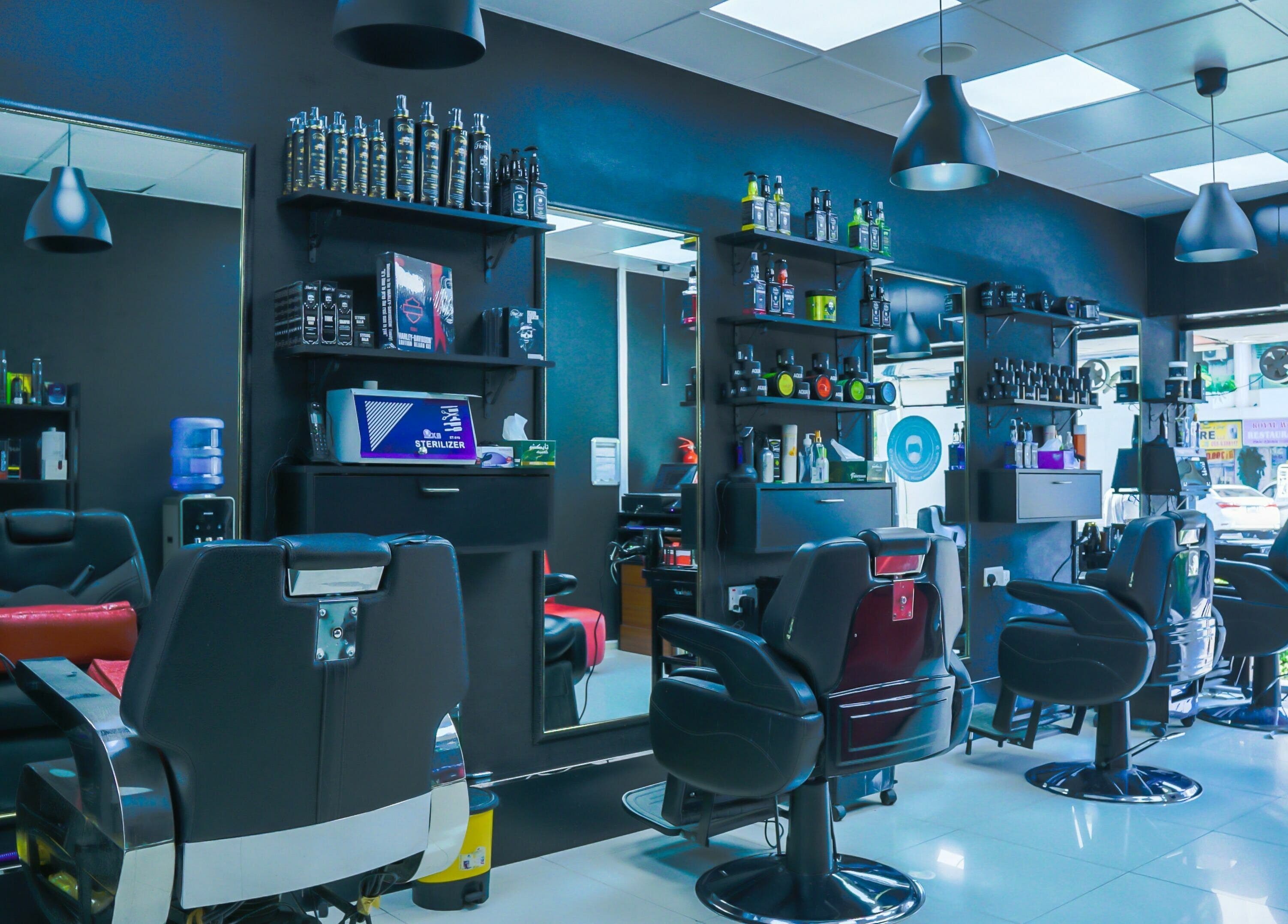 Chic interior of Fadez Gents Salon in Dubai, AE, featuring modern chairs and product displays.