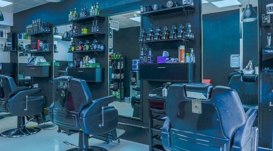 Modern interior of Fadez Gents Salon in Dubai, AE with stylish chairs and grooming products.