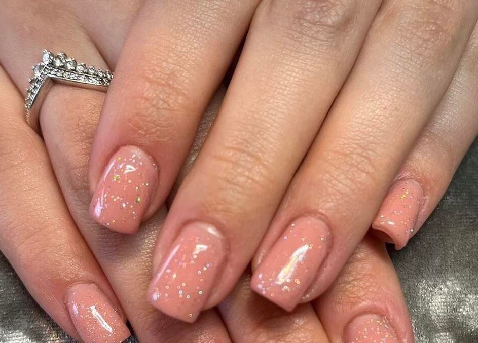 Sparkling pink nails with glitter shine at Pretty Beautiful, Waterlooville, England, GB.