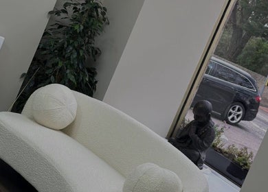 Relaxing nook with a cozy sofa at Absolute Aesthetics, Dyce, Scotland, GB, offering a serene ambiance.