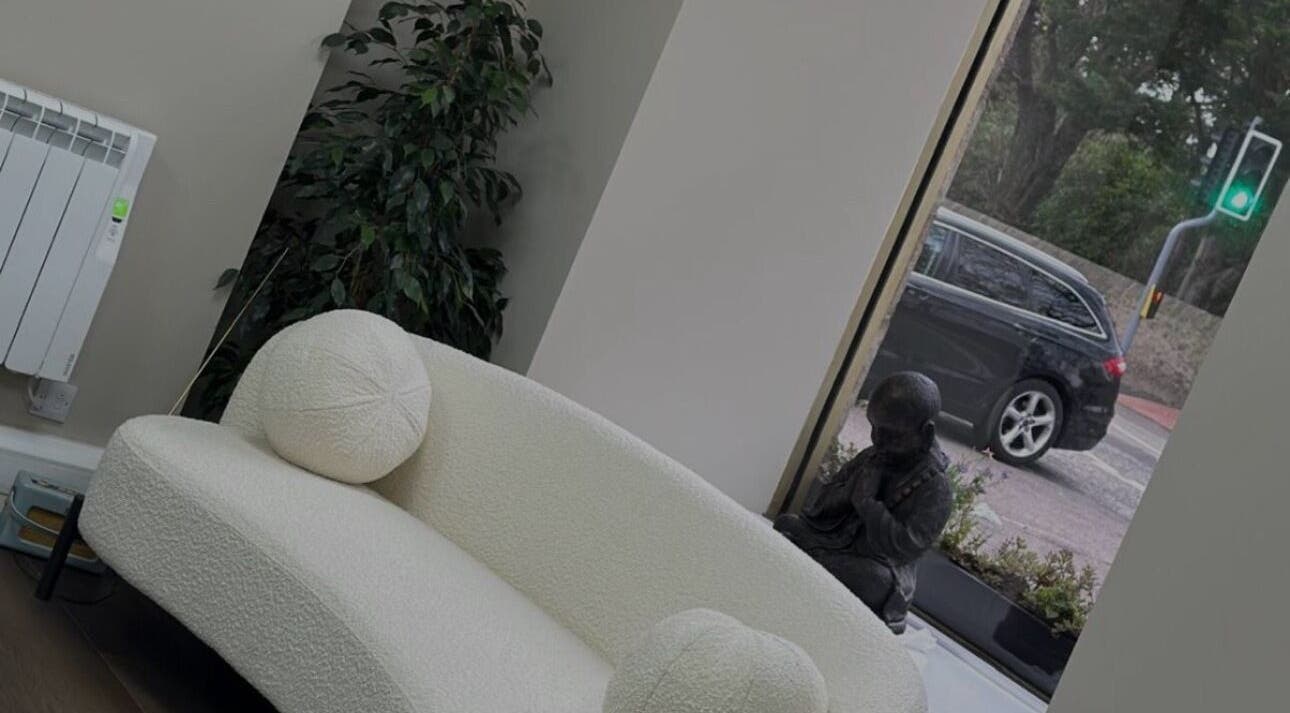 Relaxing nook with a cozy sofa at Absolute Aesthetics, Dyce, Scotland, GB, offering a serene ambiance.