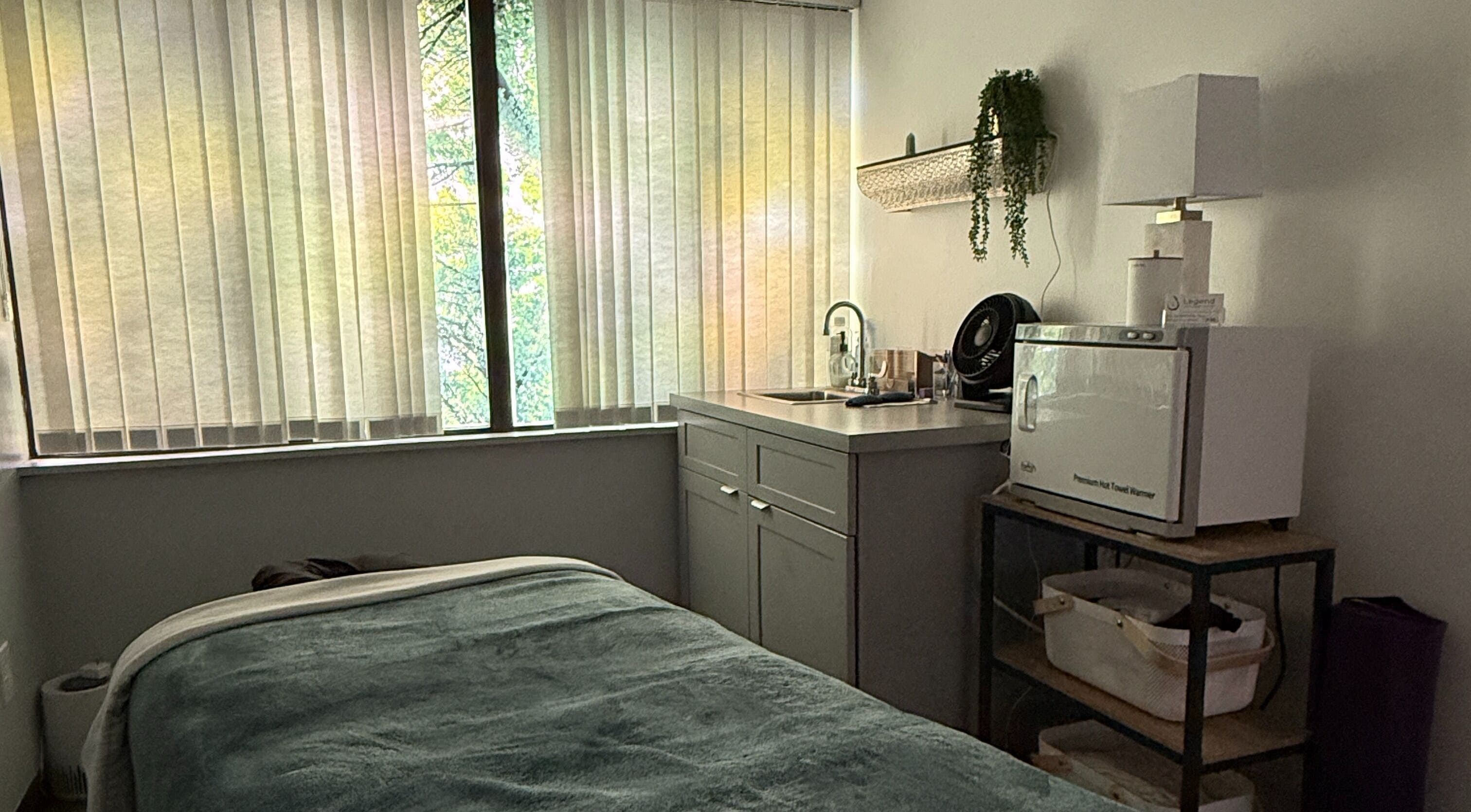 Relaxing spa room at Legend Wellness Center - Yonkers, featuring a cozy treatment bed. Yonkers, New York, US.