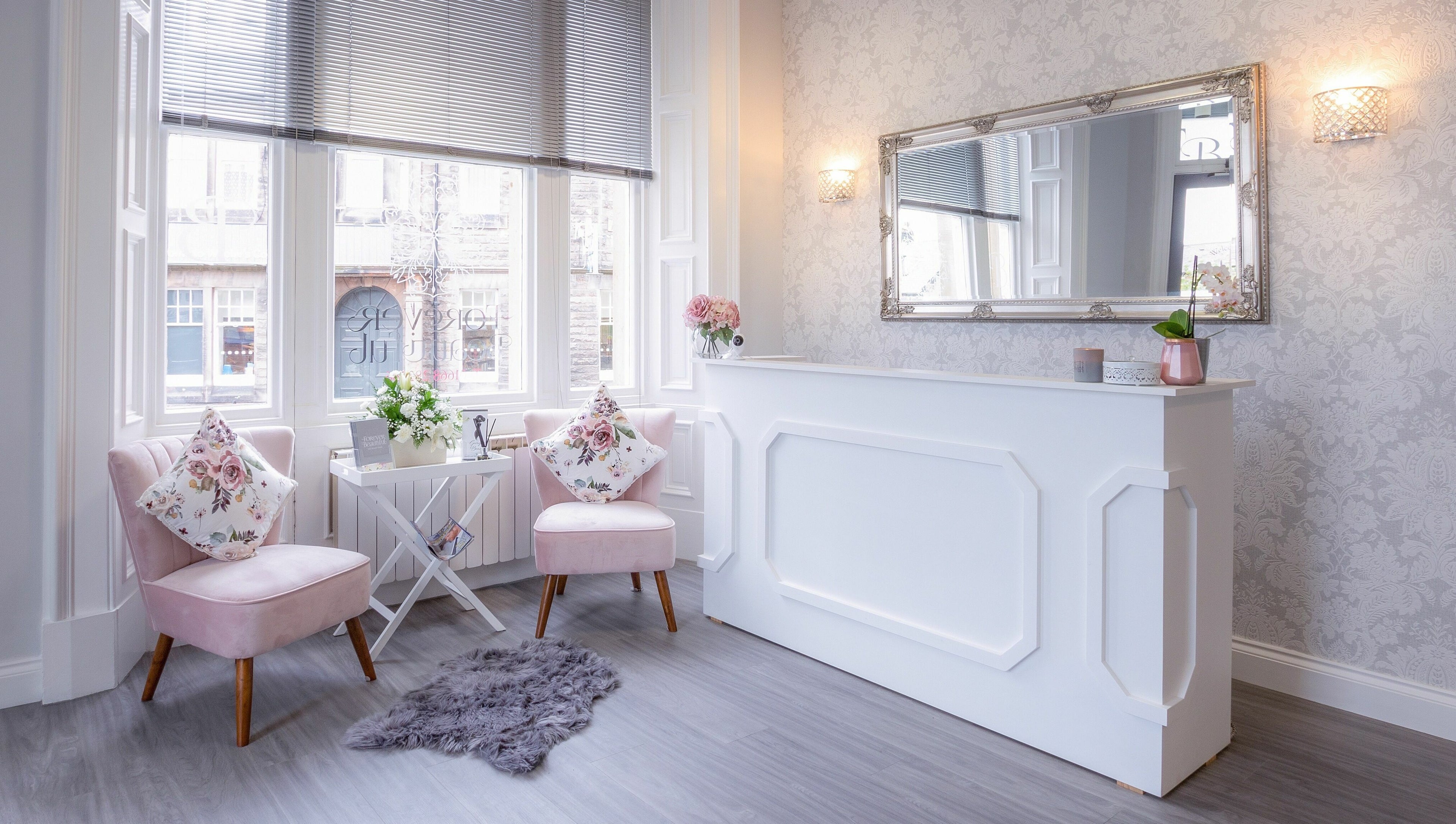 Chic reception at Forever Beautiful, Wooler, England, GB with stylish decor and floral accents.