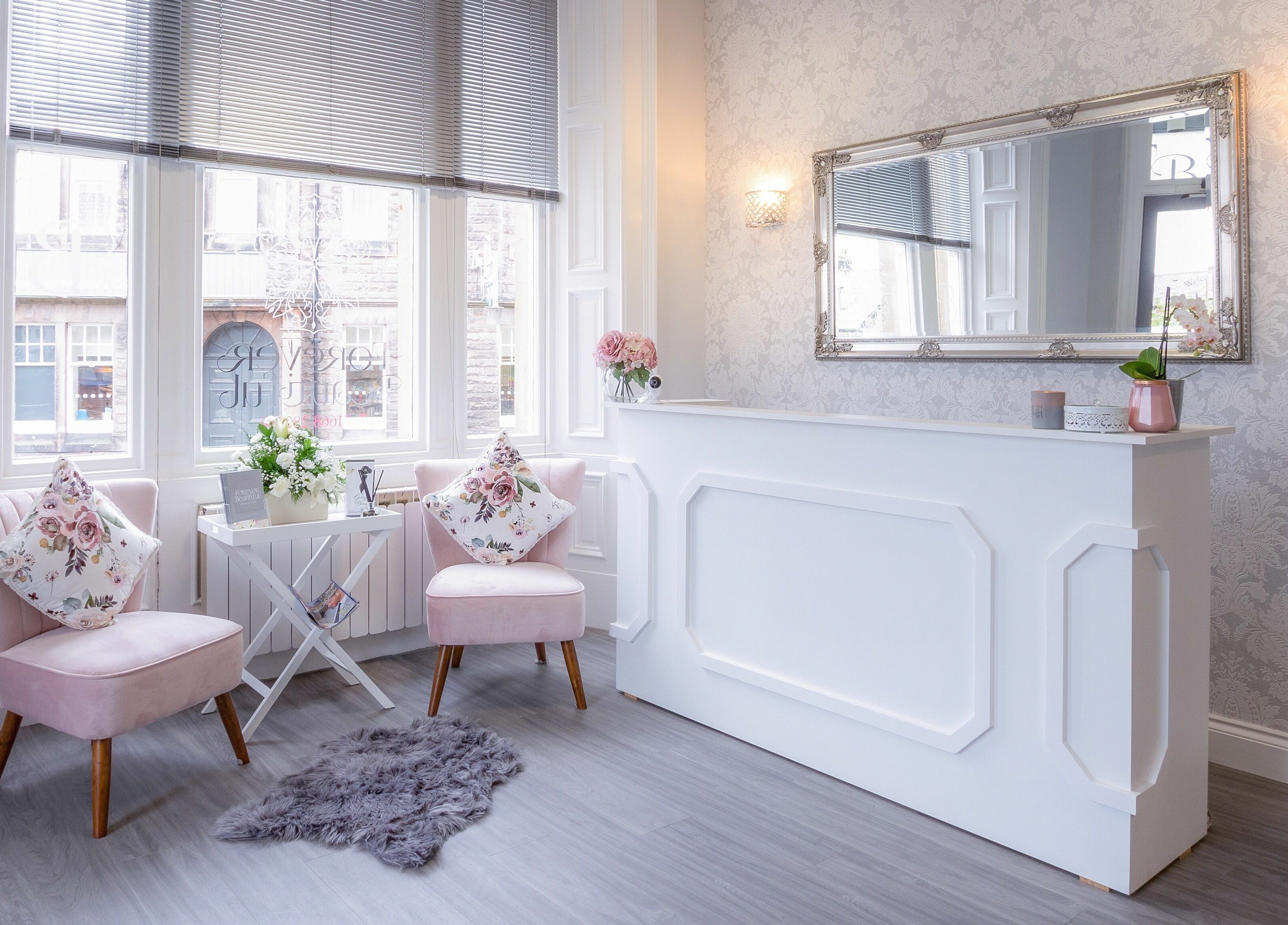 Chic reception at Forever Beautiful, Wooler, England, GB with stylish decor and floral accents.