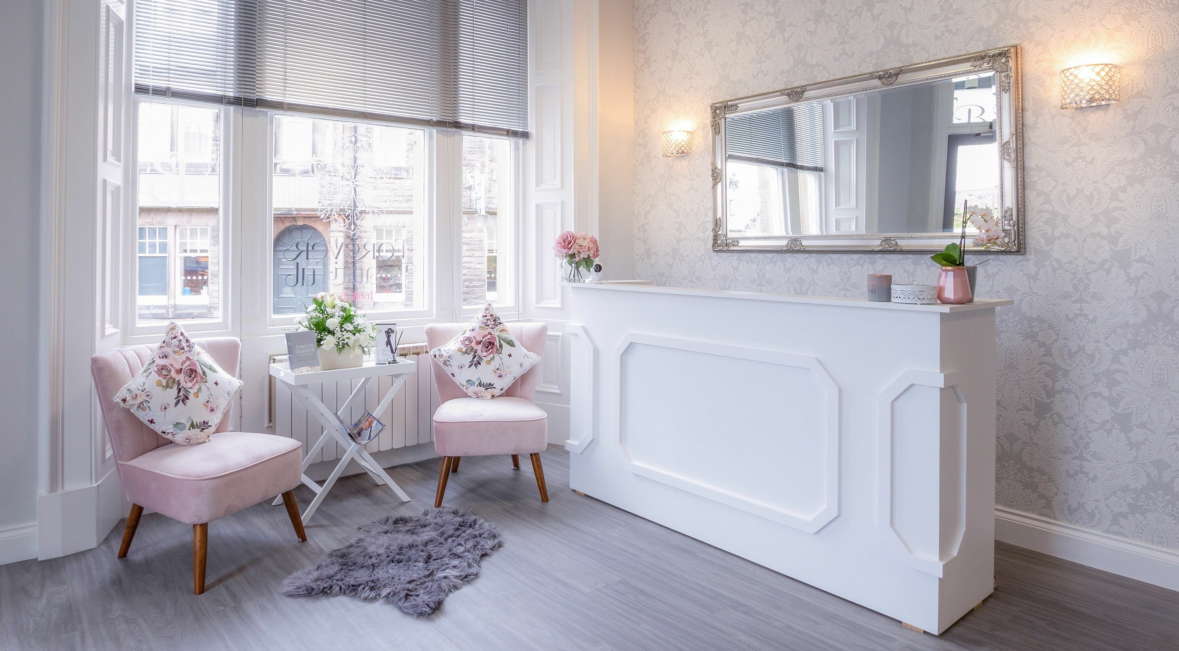 Chic reception at Forever Beautiful, Wooler, England, GB with stylish decor and floral accents.