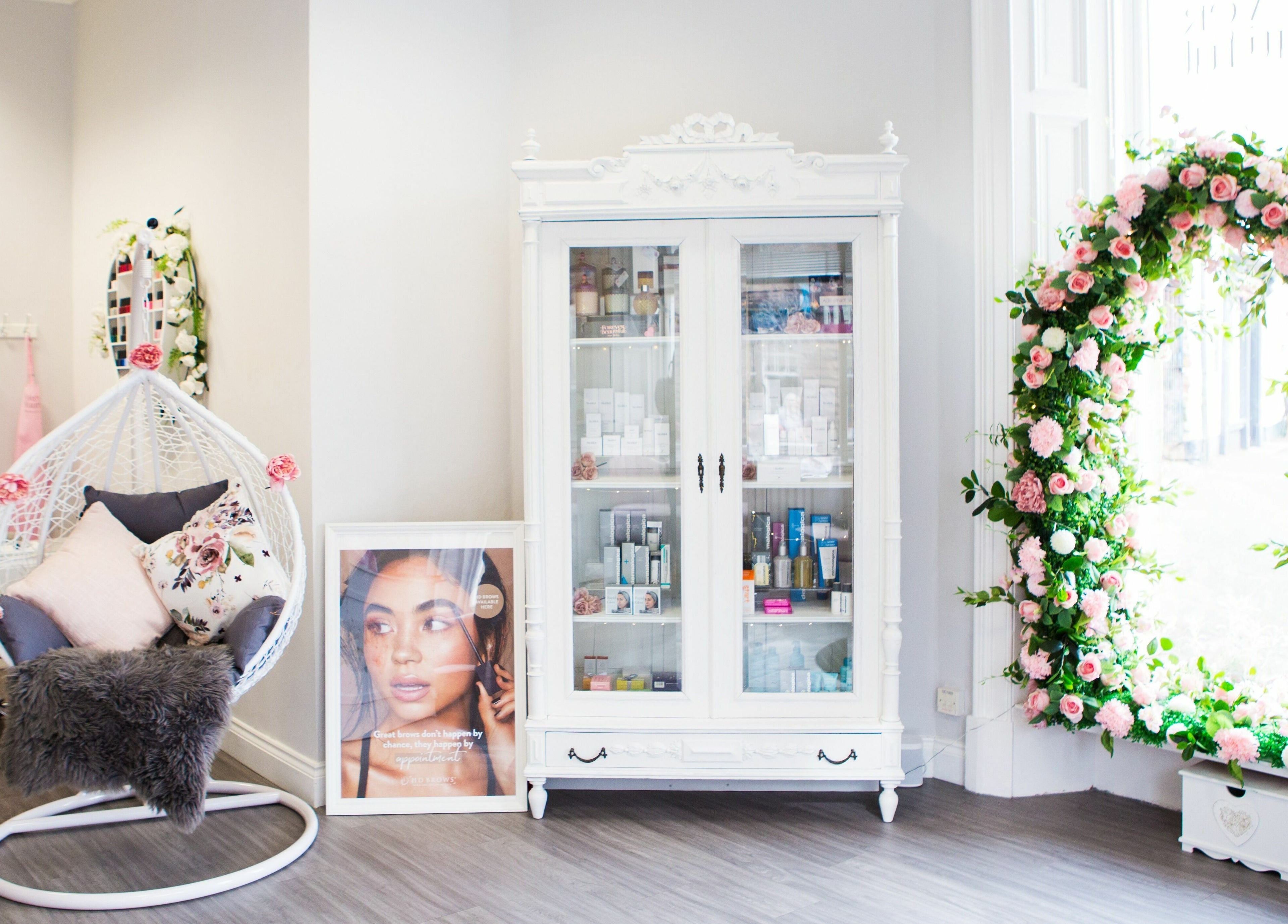 Elegant beauty corner at Forever Beautiful, Wooler, England, GB with floral decor and chic furniture.