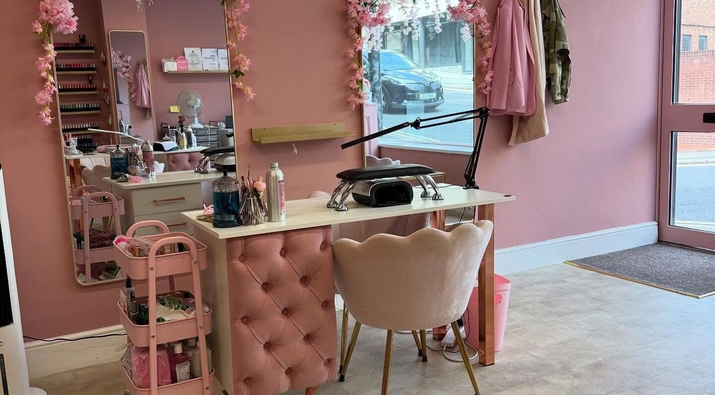 Chic nail station at Artistry Clinic in Rotherham, England. Pink decor enhances the tranquil atmosphere.