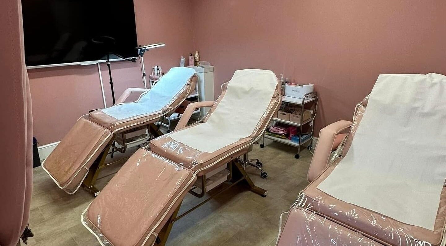 Relaxing treatment room at Artistry Clinic, Rotherham, England, GB featuring three comfortable chairs.