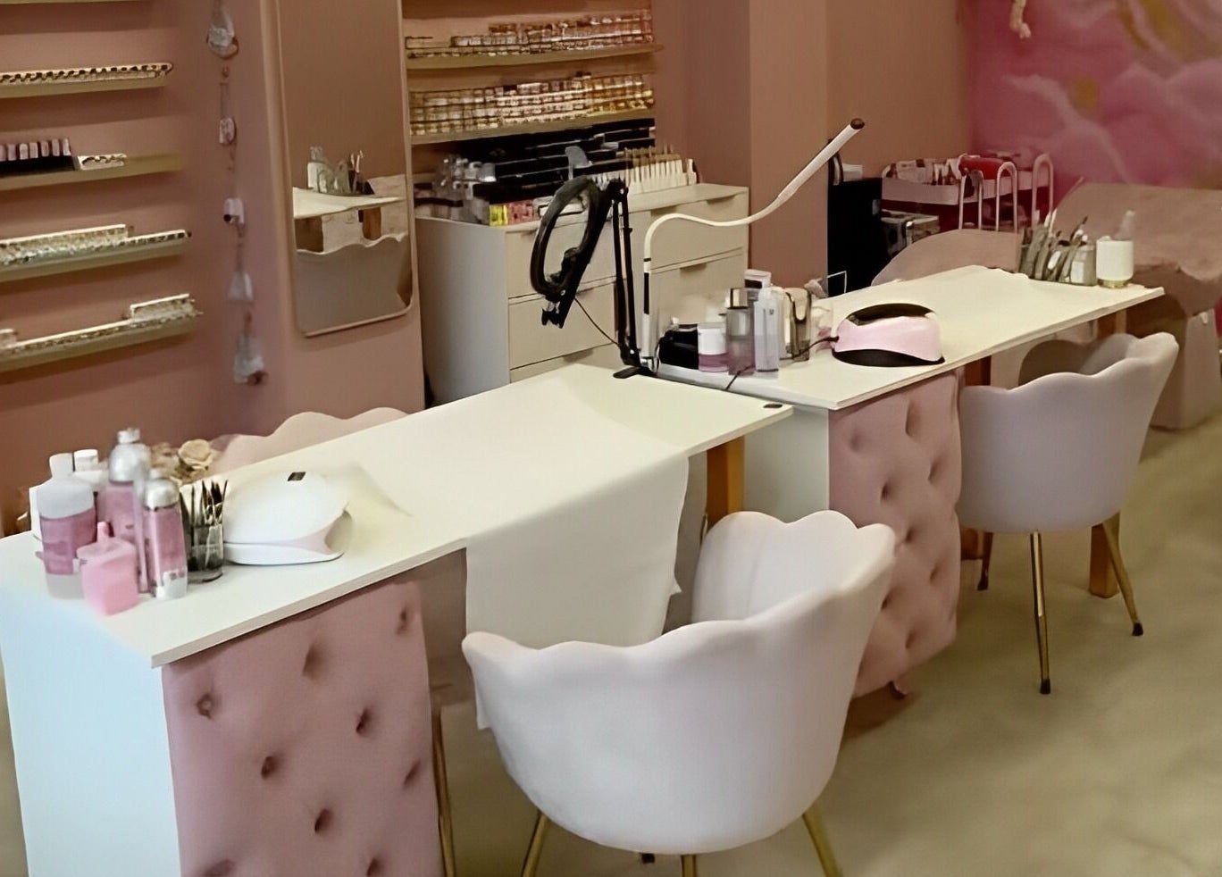 Stylish beauty treatment area at Artistry Clinic, Rotherham, England, GB with chic pink decor.