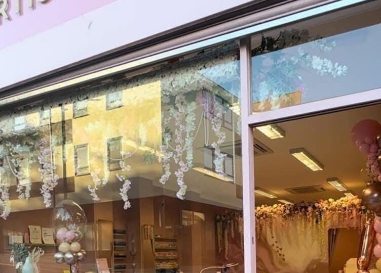 Artistry Clinic entrance with floral decor in Rotherham, England, GB.