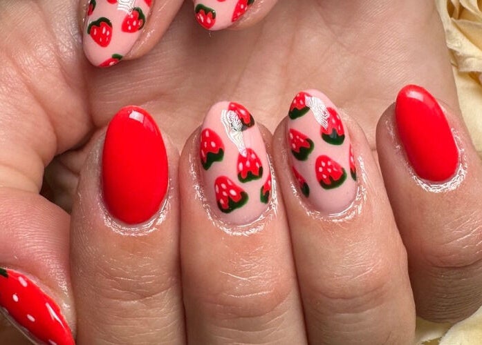 Vibrant strawberry nail art from Artistry Clinic, Rotherham, England, GB, showcasing detailed hand-painted designs.