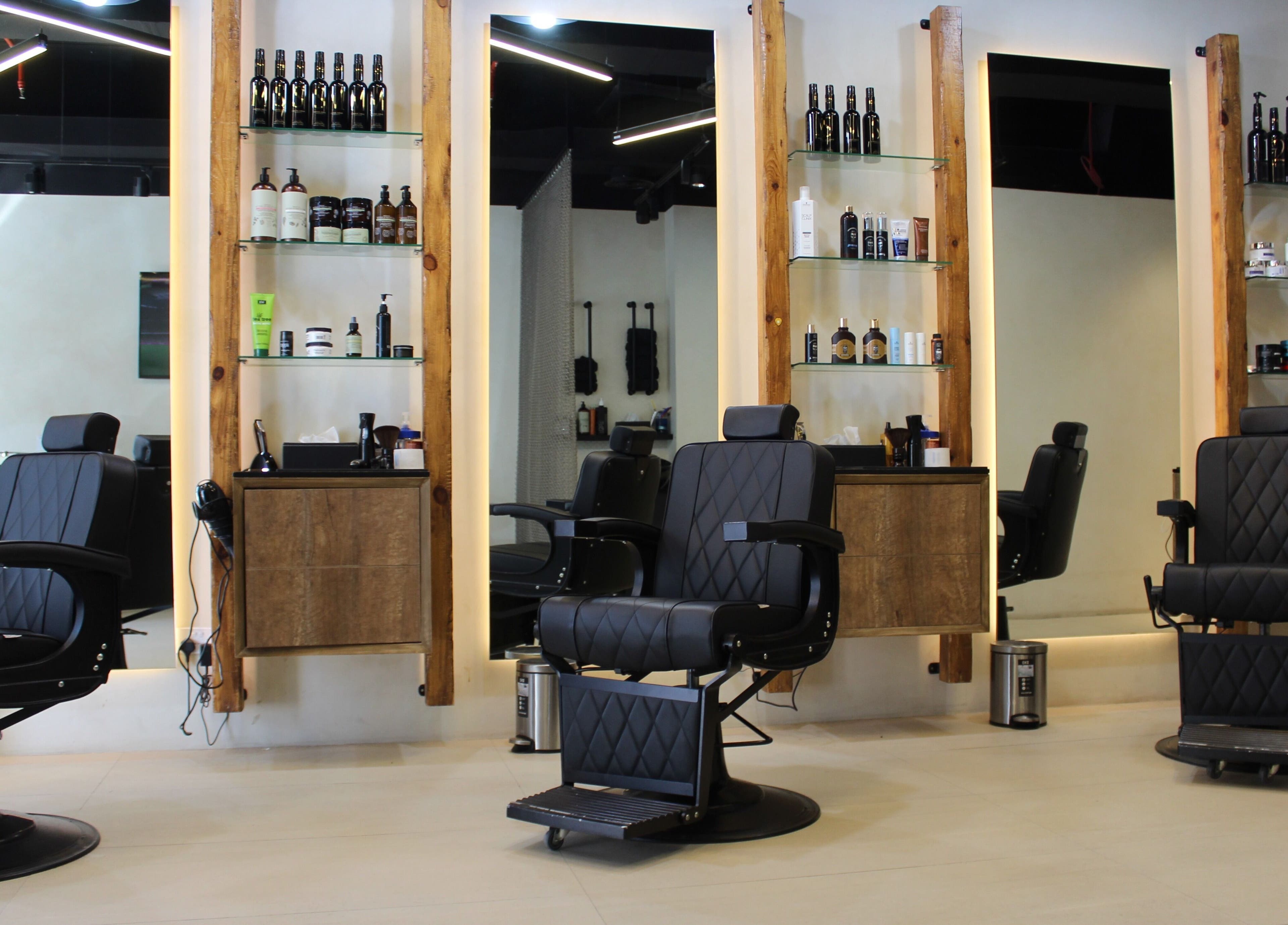 Modern salon chairs in Hairmess, Dubai, Dubai, AE, showcasing a sleek and professional setting.