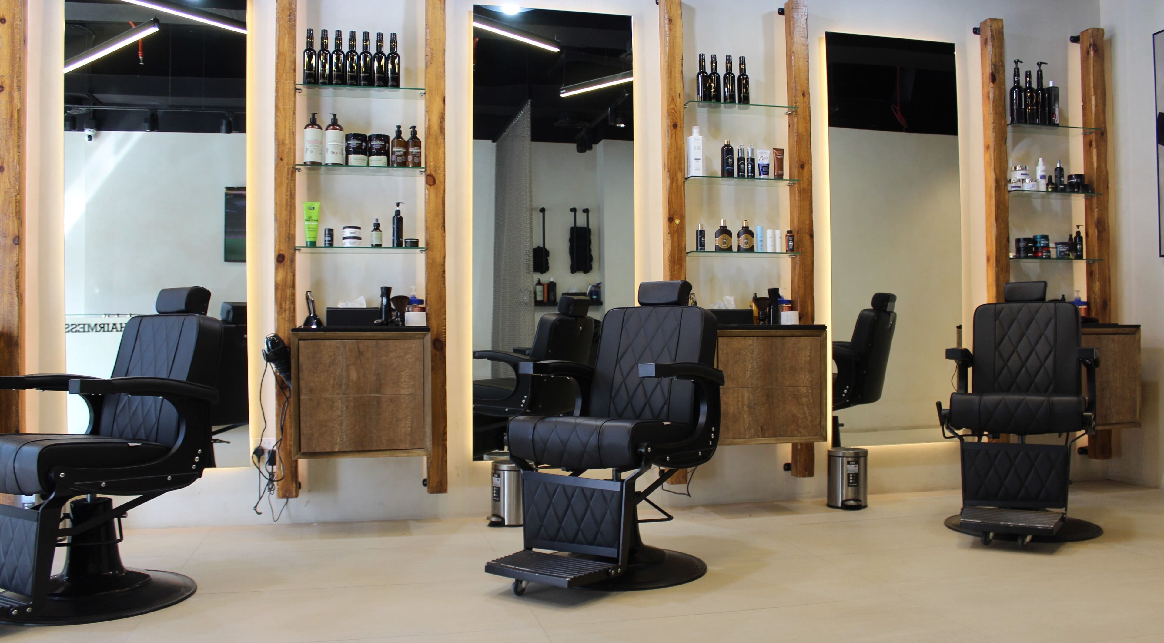 Modern salon chairs in Hairmess, Dubai, Dubai, AE, showcasing a sleek and professional setting.
