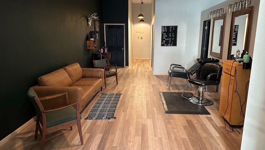 Contemporary salon interior at The Body Shoppe, Darlington, Wisconsin, US, with stylish seating and mirrors.