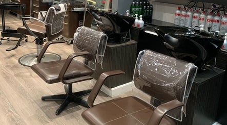 Modern salon styling chairs at 888 Salon, Chicago, Illinois, US, showcasing sleek, comfortable seating.