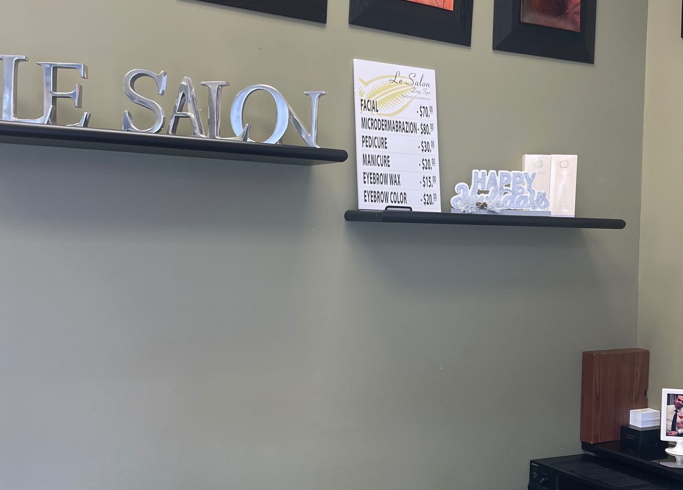 Stylish decor and service menu at Le Salon & Spa, Chicago, Illinois, US, showcasing exclusive beauty treatments.