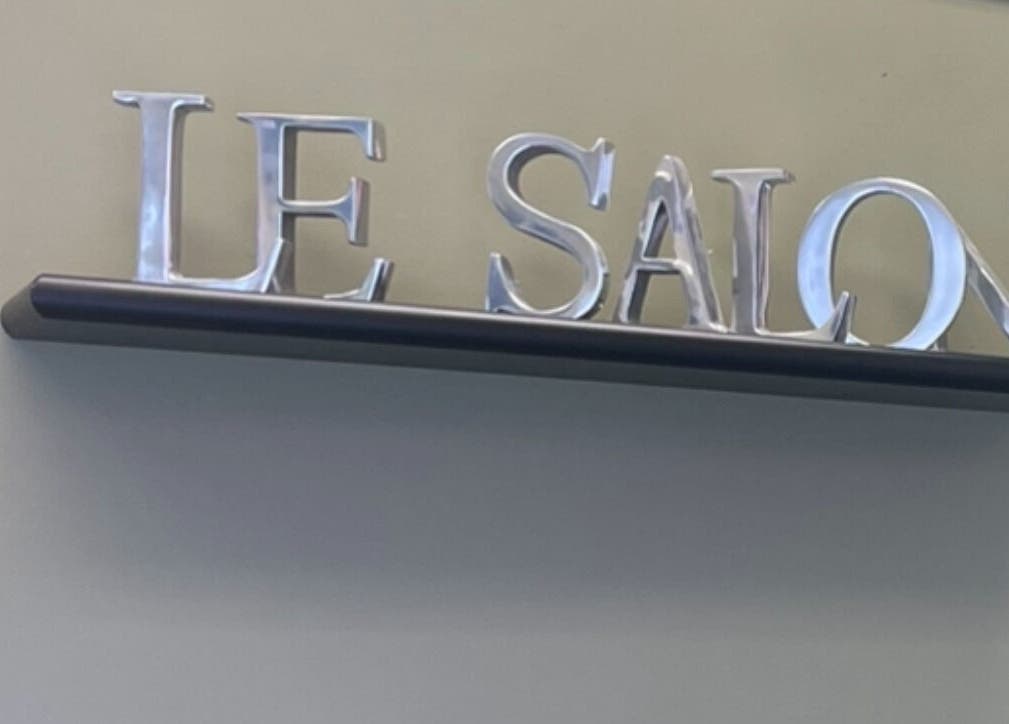 Elegant Le Salon & Spa sign on display shelf in Chicago, Illinois, US.