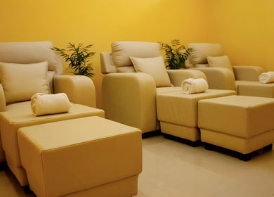 Plush spa seating at Elanza de Look Unisex Salon & Spa, Bogmalo, Goa, IN, offering a relaxing experience.