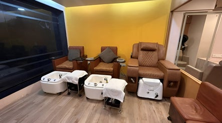 Pedicure area at Elanza de Look Unisex Salon & Spa, Bogmalo, Goa with plush leather chairs and foot baths.