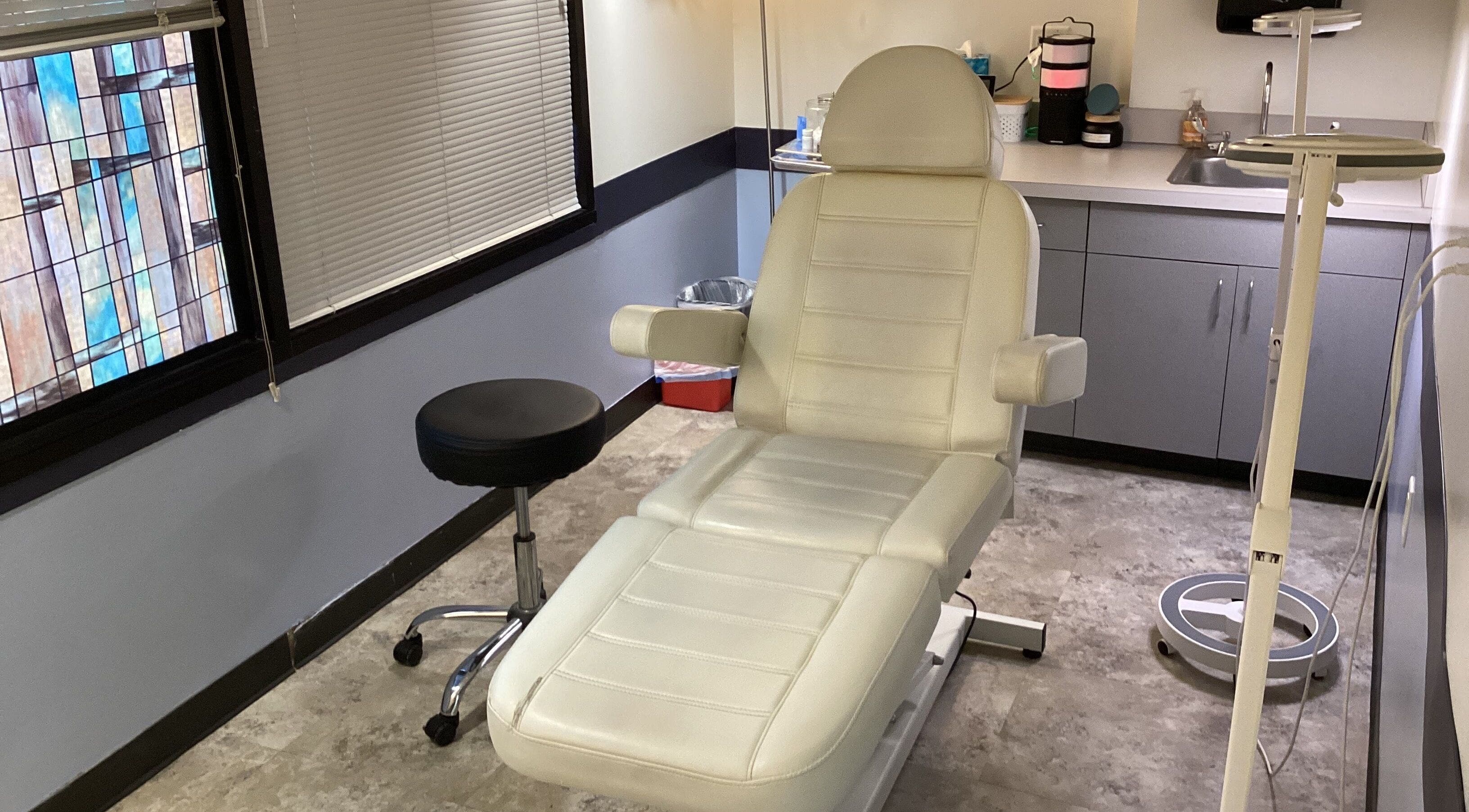 Tranquil treatment room at New Heights Med Spa, Houston, Texas, US, featuring a plush reclining chair.