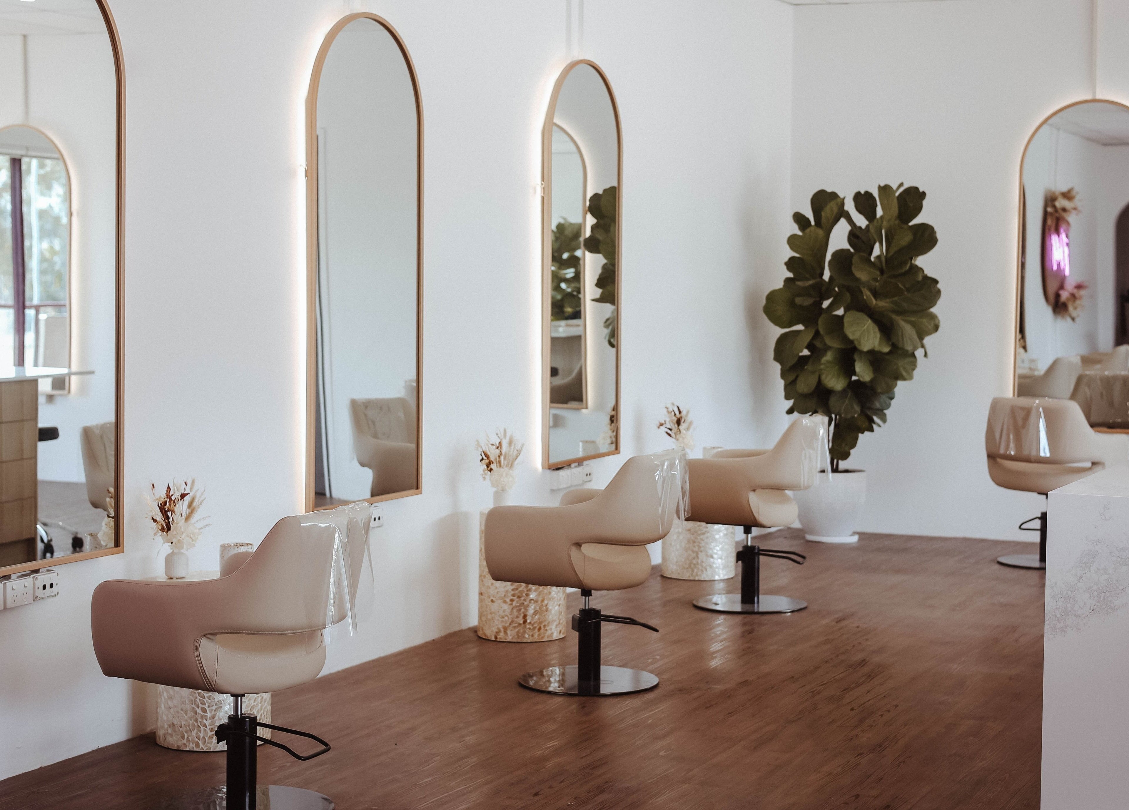 Chic salon chairs and mirrors at Hair and the Fiddle, Narellan, New South Wales, AU.
