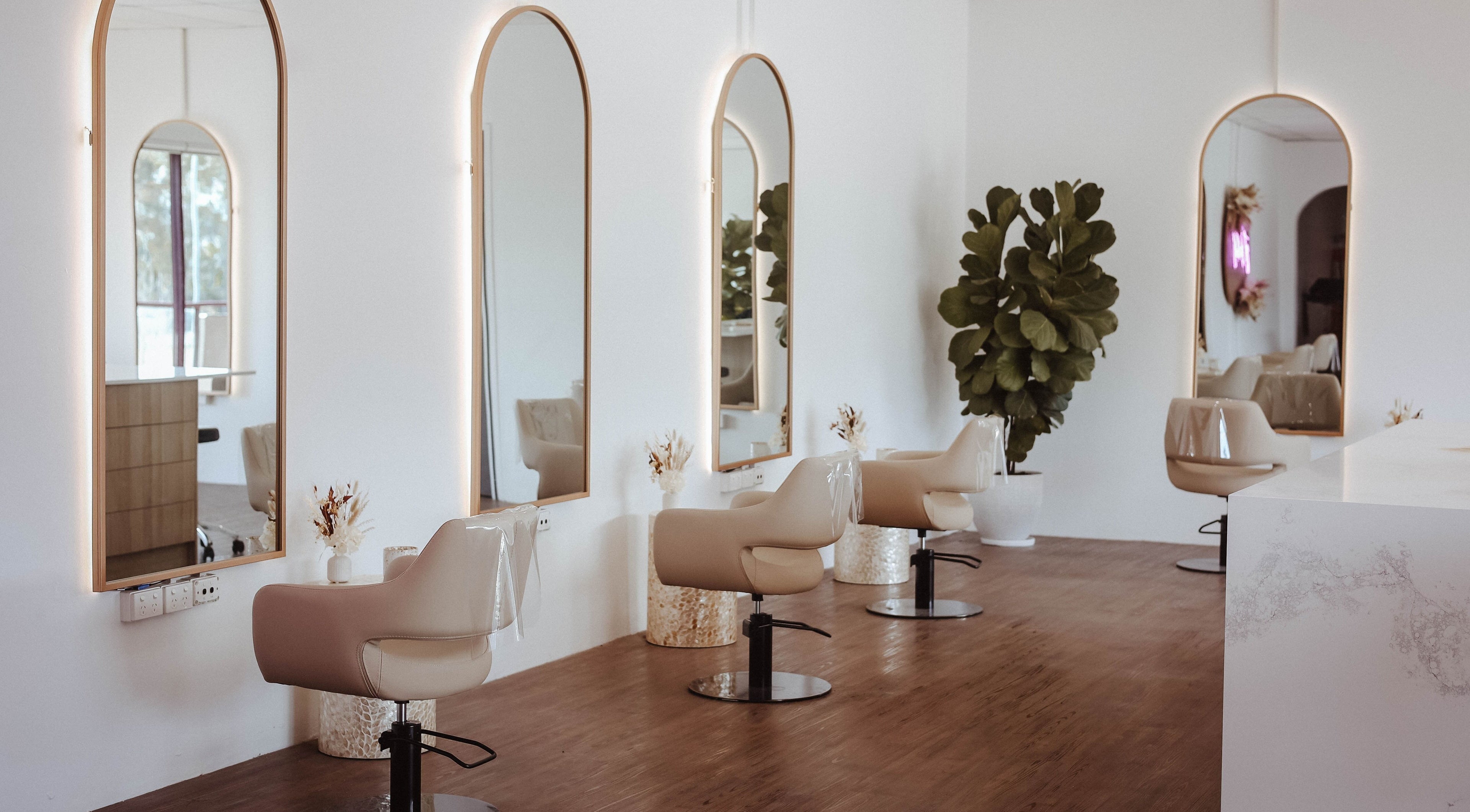 Chic salon chairs and mirrors at Hair and the Fiddle, Narellan, New South Wales, AU.