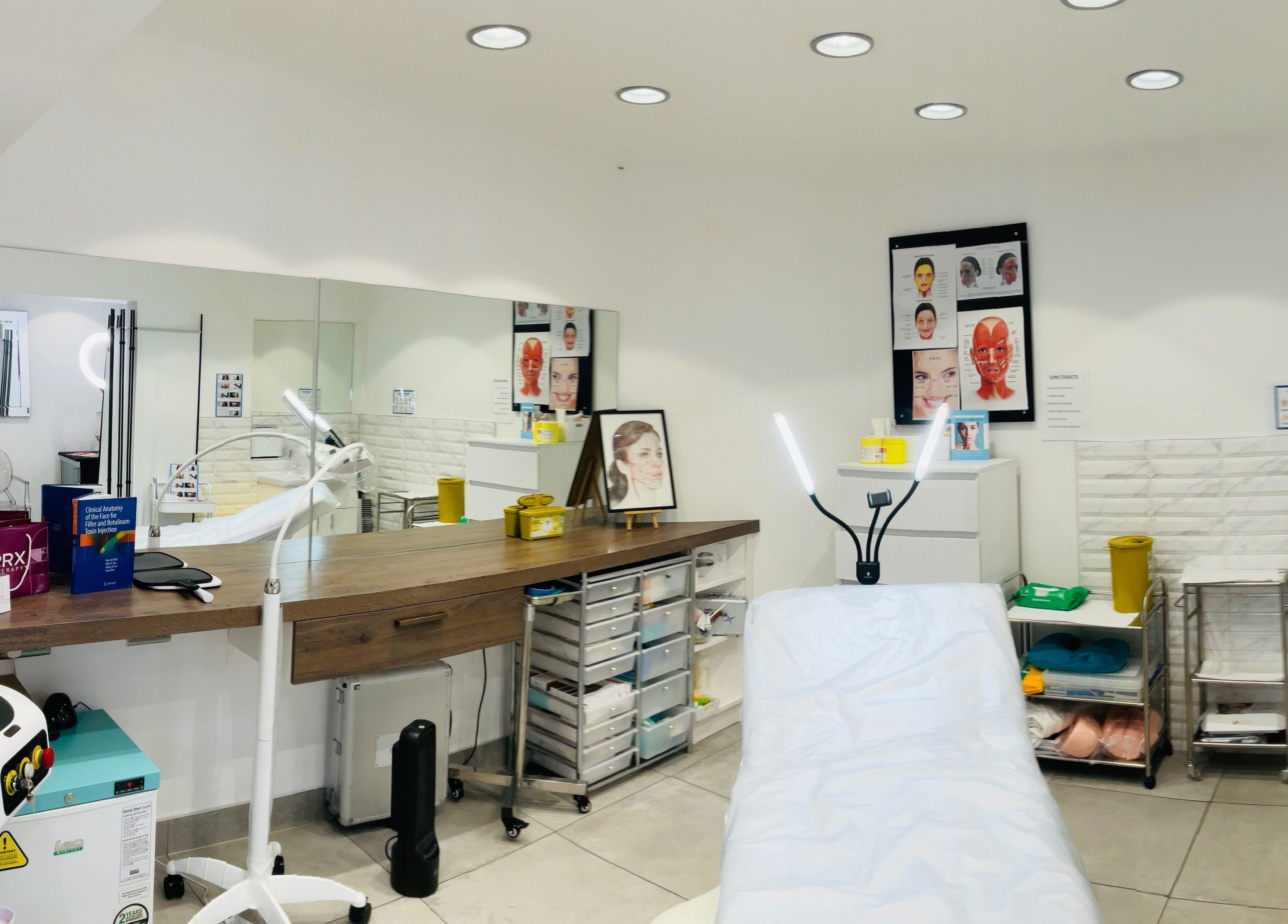 Modern treatment room at ML Aesthetics, Birmingham, England, GB, showcasing a pristine and well-equipped space.
