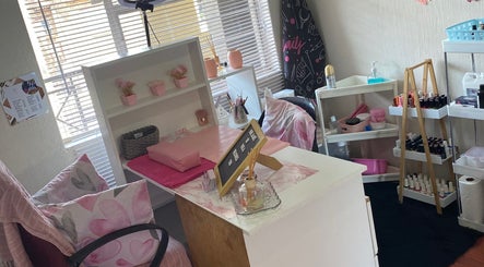 Cozy nail station at Nail and Art by Viola, Midrand, Gauteng, ZA, featuring stylish decor and polish displays.