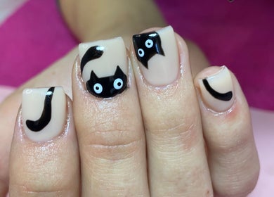 Unique cat nail art at Nail and Art by Viola, Midrand, Gauteng, ZA, showcasing creative design.