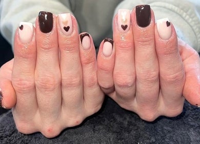 Beautiful heart-themed gel nails at Bartle Beauty, South Normanton, England, GB, showcasing expert nail art.