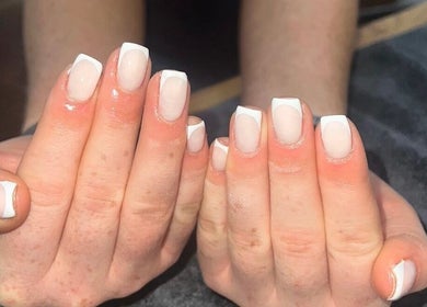 French manicure showcasing elegant nail art at Bartle Beauty, South Normanton, England, GB.