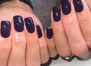 Close-up of elegant indigo manicured nails at Bartle Beauty in South Normanton, England, GB.