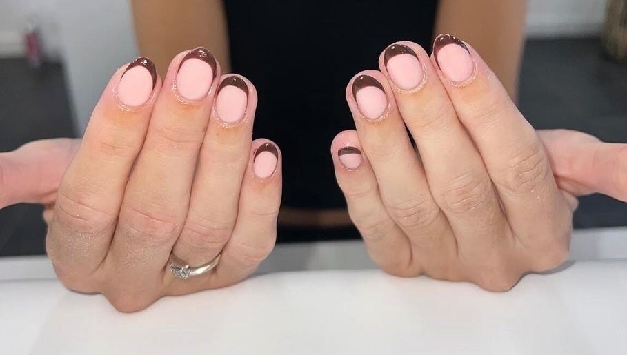 Stylish pink and brown nail art at Bartle Beauty, Somercotes, England, GB.