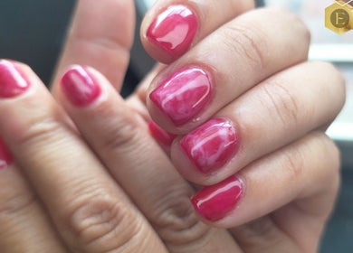 Bright pink manicured nails at Emma's Express Beauty Studio, Cape Town, Western Cape, ZA.