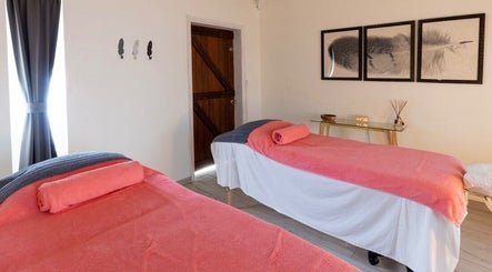Peaceful massage room at TI Spa, Grand case, Collectivité De Saint-martin, MF with two beds and calming decor.