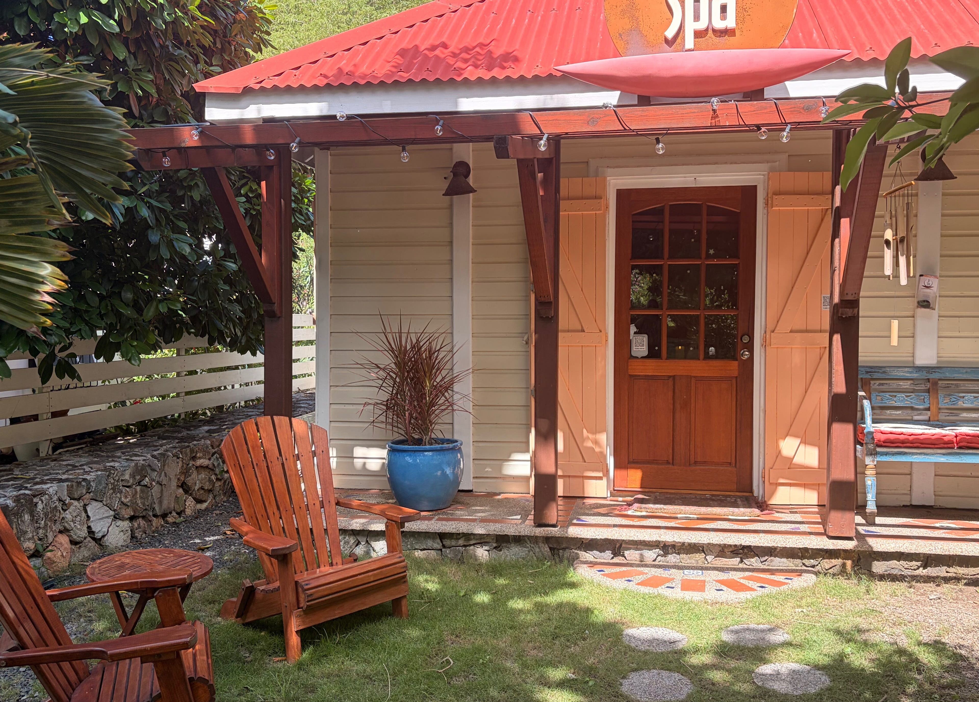 Peaceful entrance of TI Spa in Grand Case, Collectivité De Saint-martin, MF featuring outdoor seating.