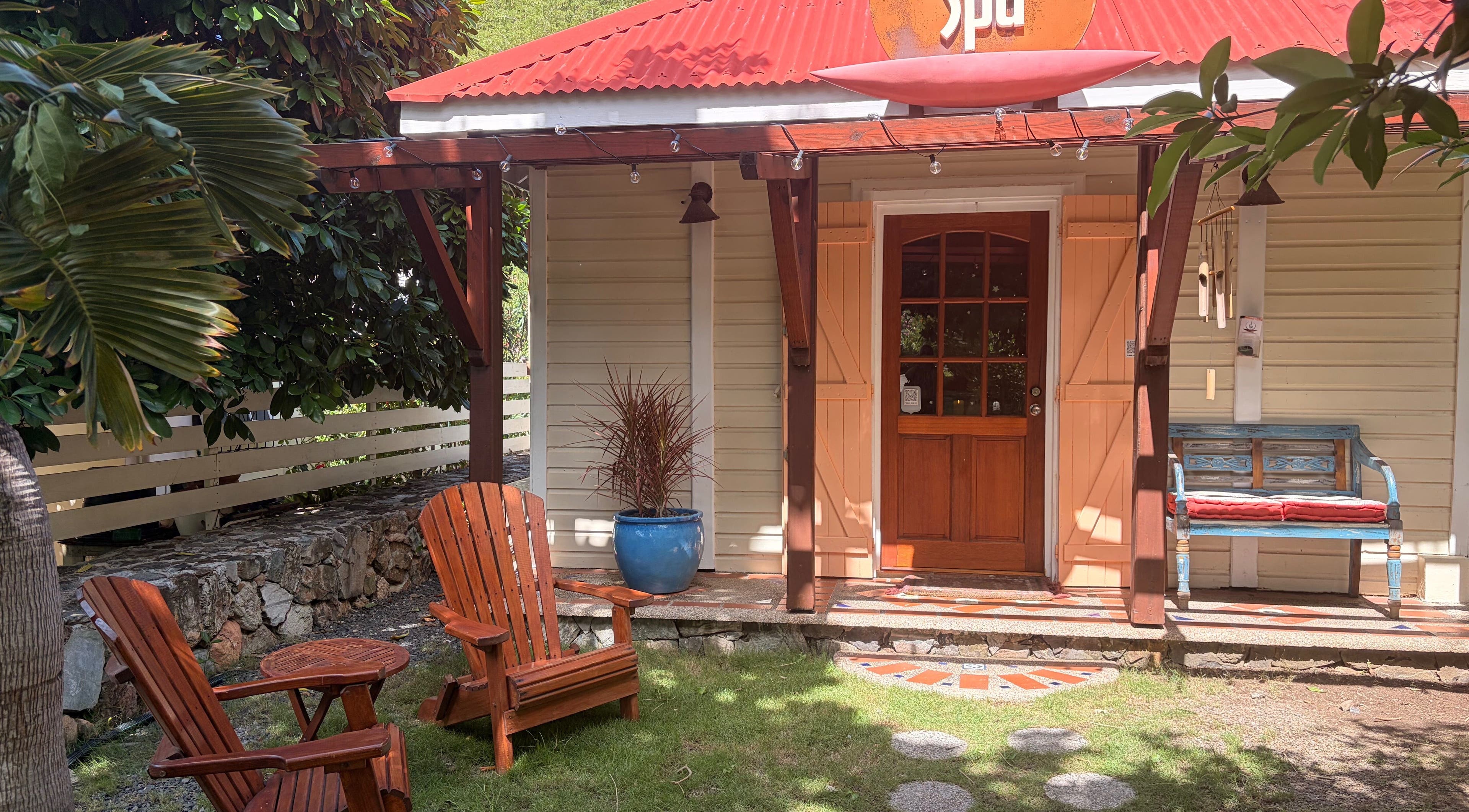 TI Spa entry in Grand Case, Collectivité De Saint-martin, MF features inviting chairs and lush greenery.