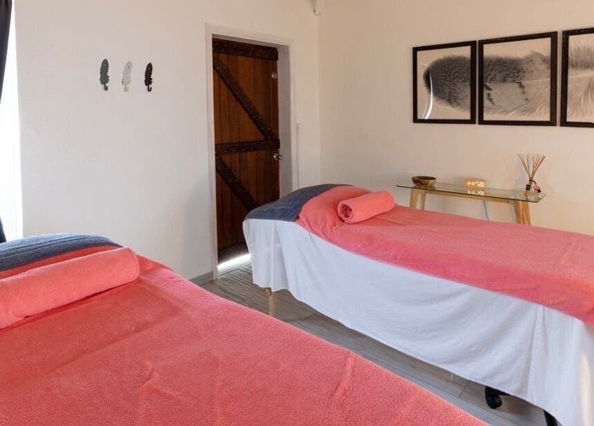 Relaxing treatment room at TI Spa, Grand Case, Collectivité De Saint-martin, MF, featuring comfortable massage tables.