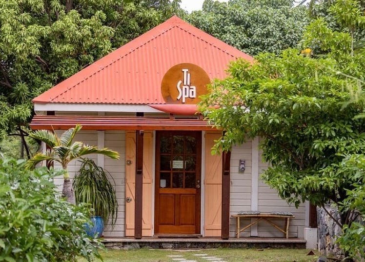 Entrance of TI Spa surrounded by lush greenery in Grand Case, Collectivité De Saint-Martin, MF.