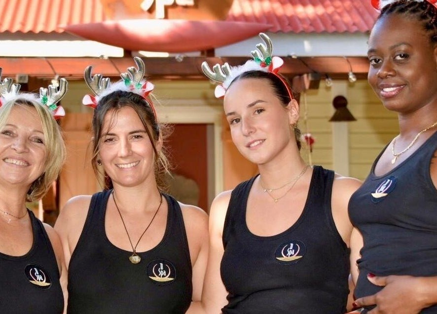 TI Spa team smiling with festive antlers at Grand case, Collectivité De Saint-martin, MF.