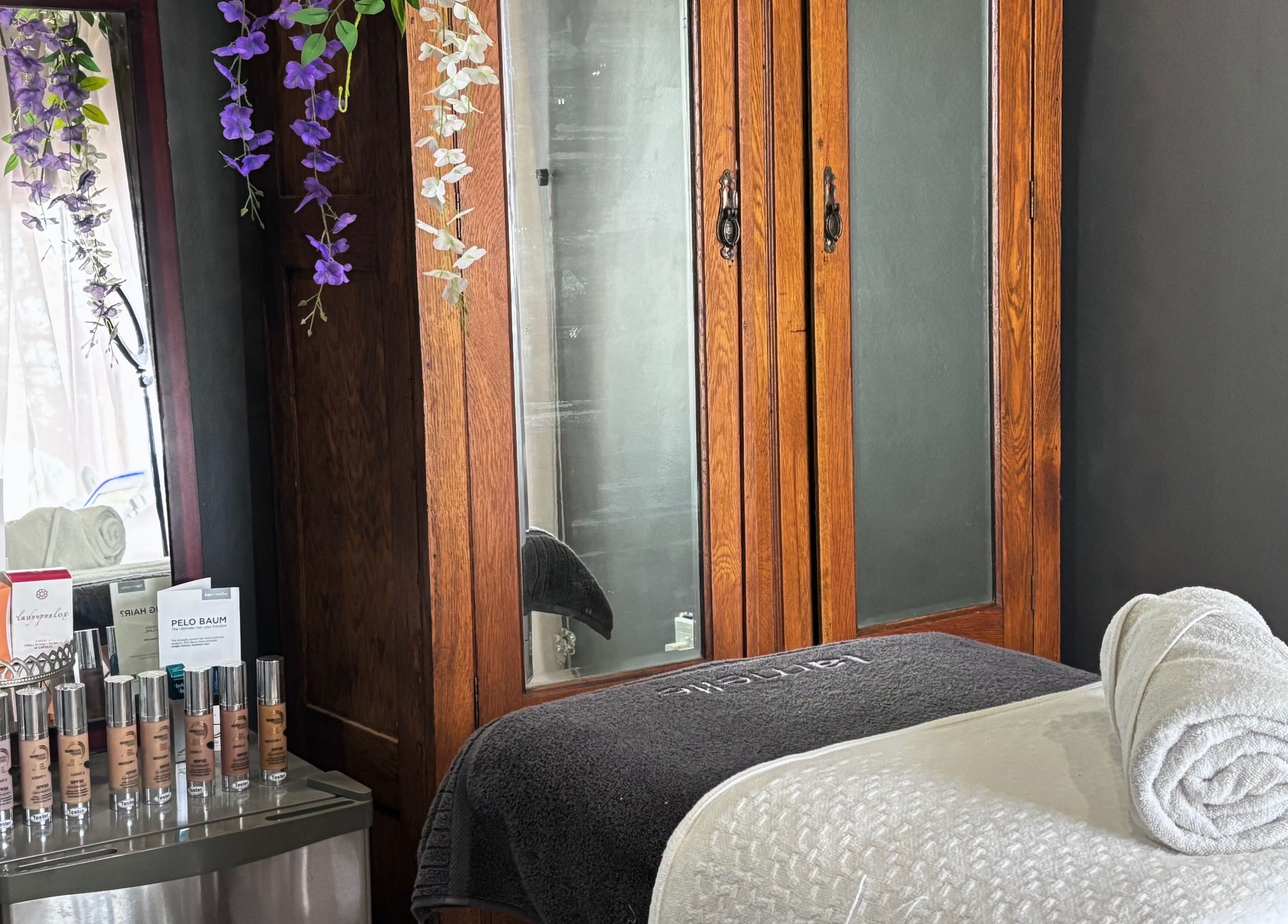Cozy treatment room at Primavera Aesthetics in Olifantsfontein, Gauteng, ZA with elegant wooden decor.
