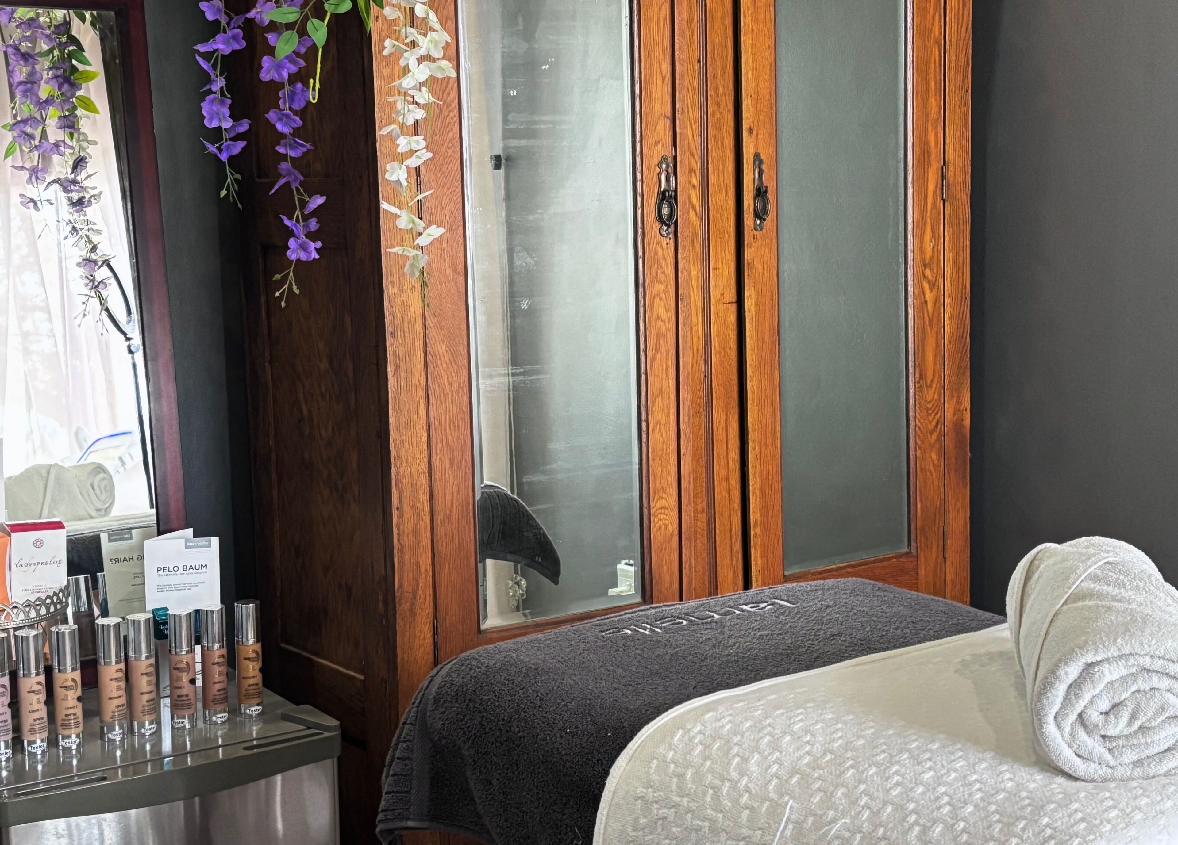 Cozy treatment room at Primavera Aesthetics in Olifantsfontein, Gauteng, ZA with elegant wooden decor.
